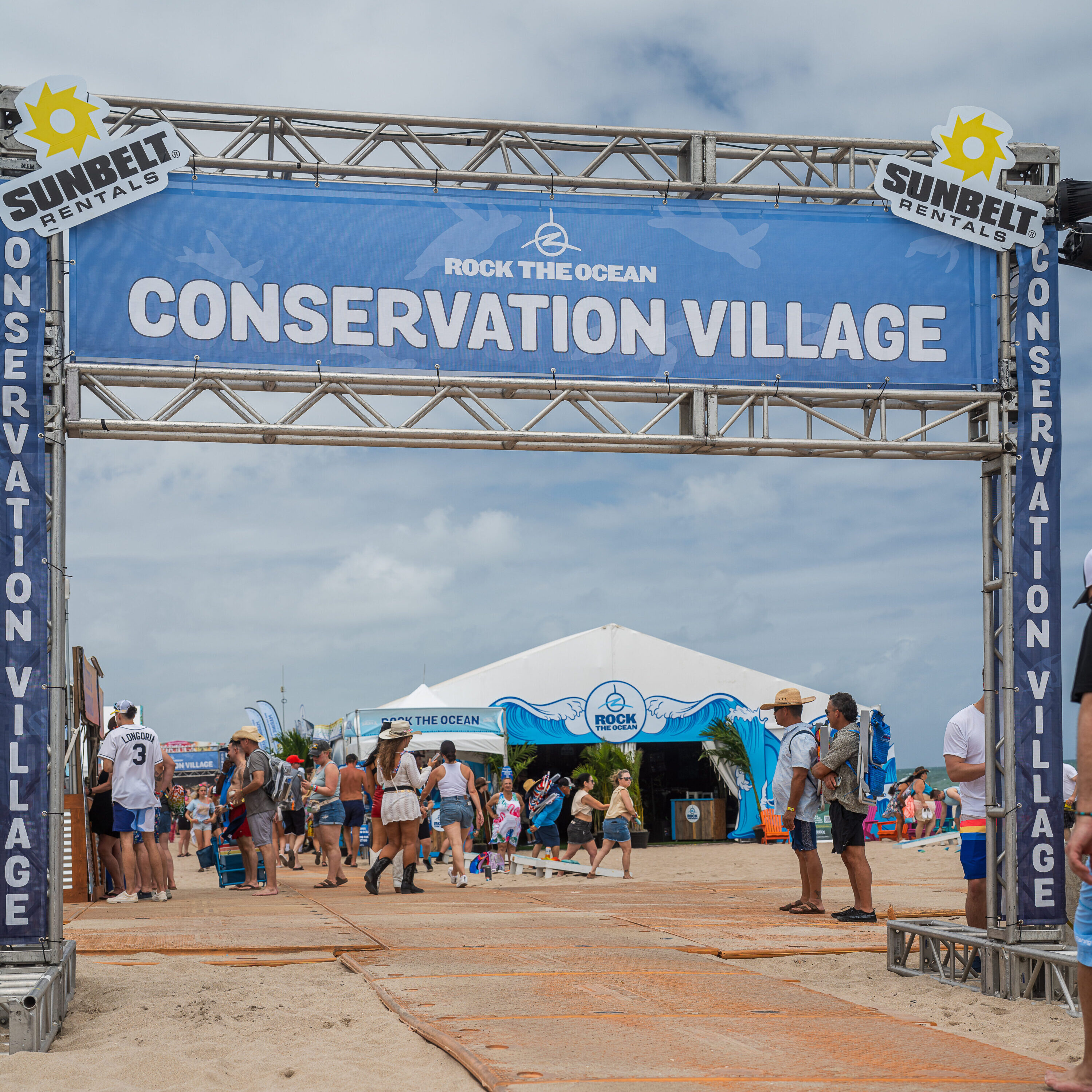 Conservation Village Banner on the beach