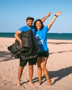 Volunteers at Beach Cleanup holding Scrim