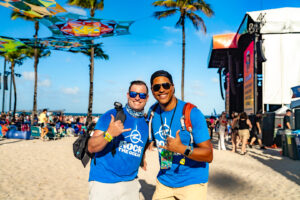 Volunteers in front of stage on beach