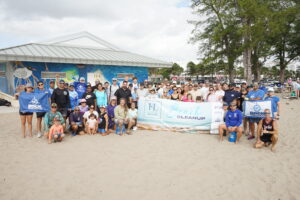 Group photo of volunteers at 3rd Annual FLIBS Beach Cleanup